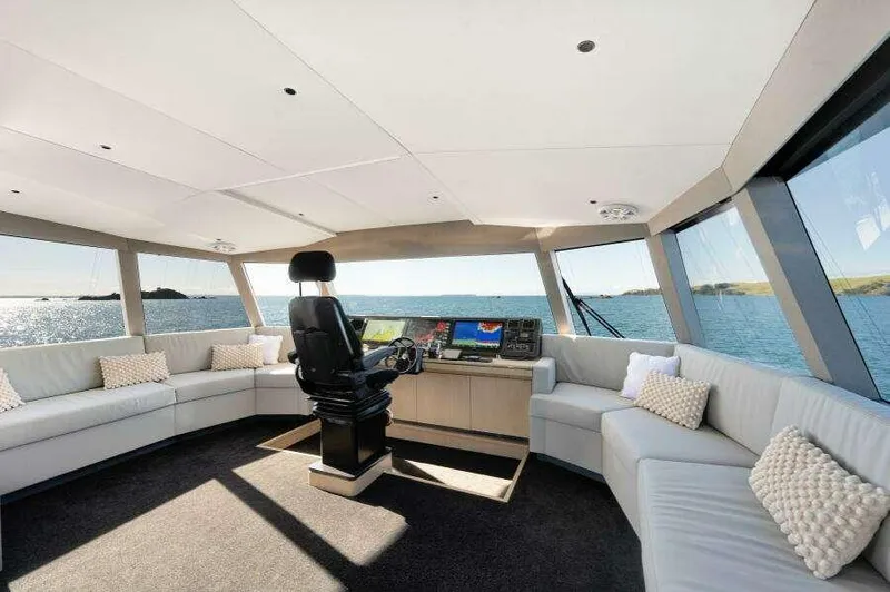 Slide: The Image of Luxurious interior of 2026 McConaghy MC63P yacht with panoramic windows and plush seating. - 19
