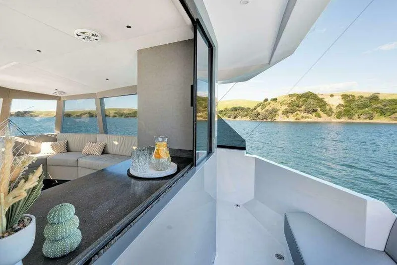 Slide: The Image of Luxurious McConaghy MC63P yacht interior with scenic ocean view, modern design, and comfortable seating. - 20