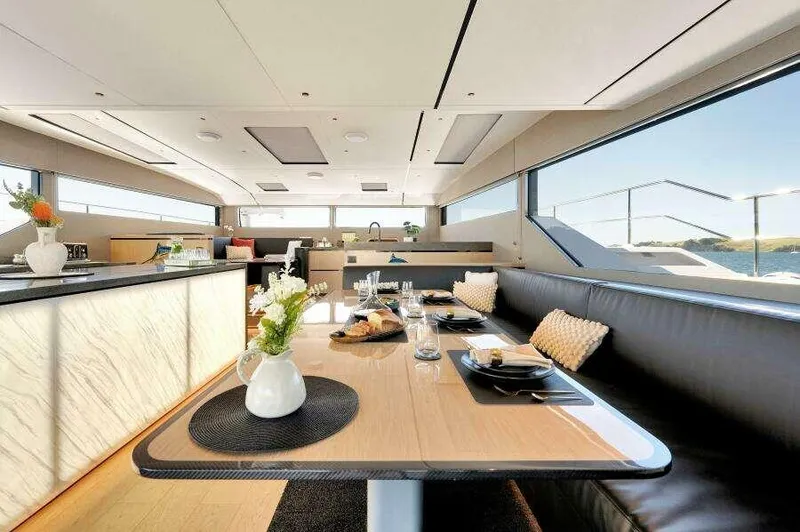 Slide: The Image of Luxurious interior of 2026 McConaghy MC63P yacht with elegant dining area and modern design. - 24
