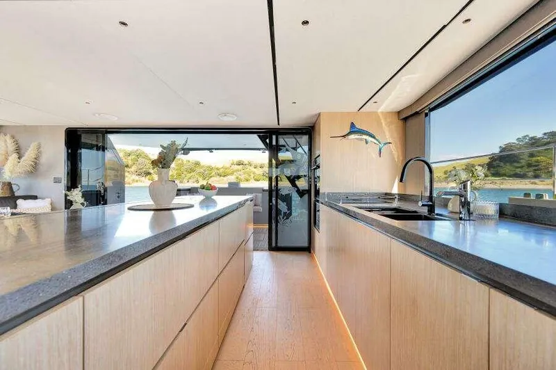 Slide: The Image of Luxurious McConaghy MC63P 2026 yacht interior with modern kitchen and scenic ocean view. - 25