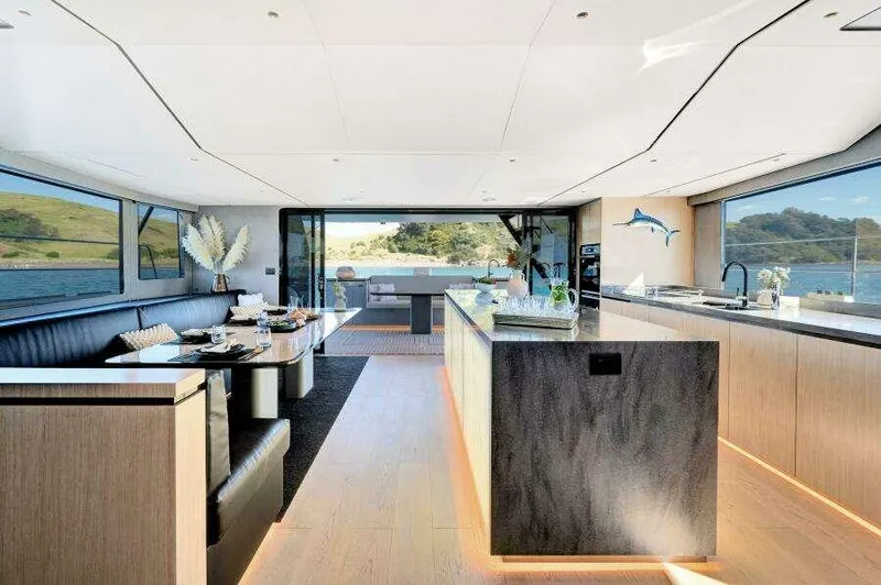 Slide: The Image of Luxurious interior of 2026 McConaghy MC63P yacht with modern kitchen and dining area. - 27