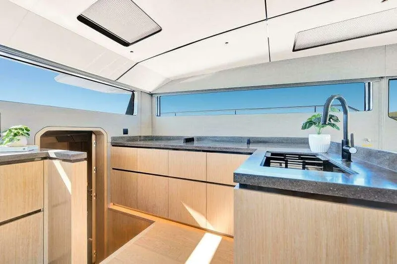 Slide: The Image of Luxurious interior of 2026 McConaghy MC63P yacht with modern kitchen design. - 28