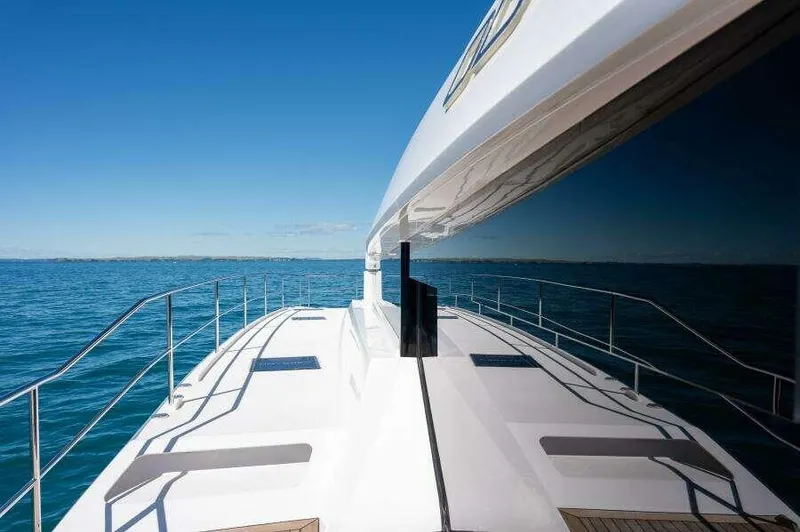 Slide: The Image of Luxurious 2026 McConaghy MC63P yacht cruising on open blue sea. - 30