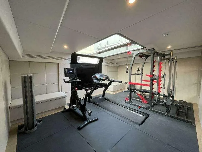 Slide: The Image of Luxurious gym on McConaghy MC63P yacht, featuring modern exercise equipment, 2026 model. - 34