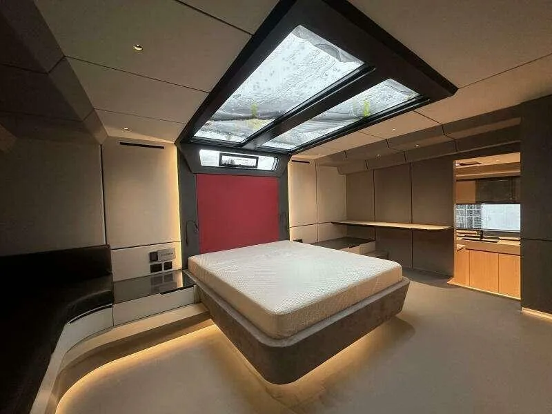 Slide: The Image of Luxurious interior of 2026 McConaghy MC63P yacht with modern design and skylight. - 35