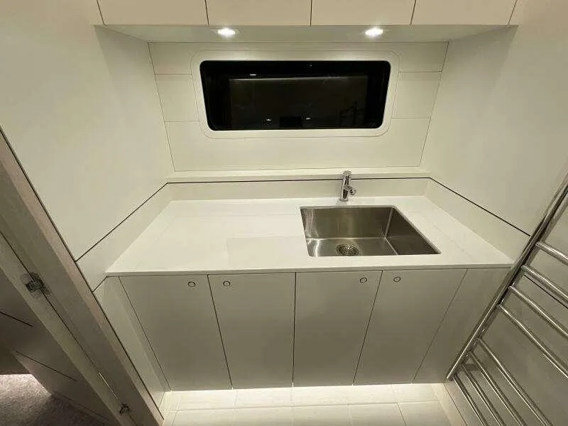 Slide: The Image of Modern kitchen area in 2026 McConaghy MC63P yacht with sleek cabinetry and stainless steel sink. - 39