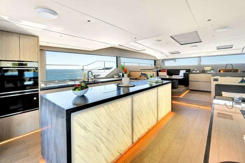 Slide: The Image of Luxurious interior of 2026 McConaghy MC63P yacht with modern kitchen and ocean view. - 4