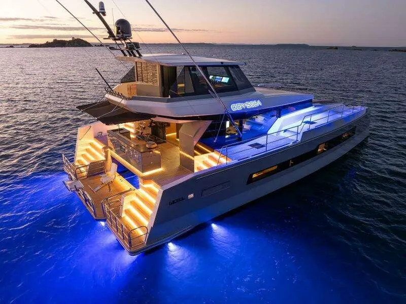 Slide: The Image of Luxurious 2026 McConaghy MC63P yacht illuminated at sunset, featuring elegant design and ambient lighting. - 5