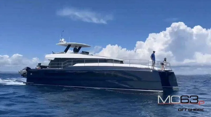 Slide: The Image of 2026 McConaghy MC63P yacht cruising on open sea under clear blue sky. - 7