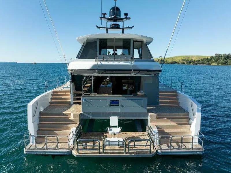 Slide: The Image of Luxury McConaghy MC63P yacht, 2026 model, on serene blue waters with open deck view. - 8