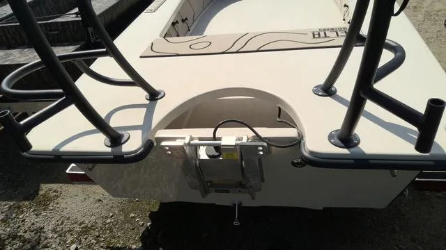 Slide: The Image of 2025 Xplor D18 Guide (Tiller) boat, rear view with rod holders and motor mount. - 11