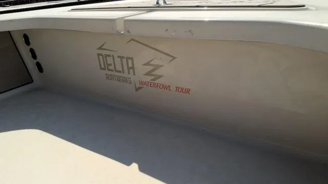 Slide: The Image of 2025 Xplor D18 Guide boat interior with Delta Waterfowl Tour branding. - 5
