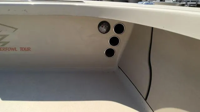 Slide: The Image of 2025 Xplor D18 Guide (Tiller) boat interior with gauge and cup holders. - 6