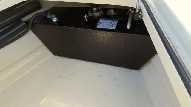 Slide: The Image of 2025 Xplor D18 Guide (Tiller) boat compartment with black fuel tank. - 7