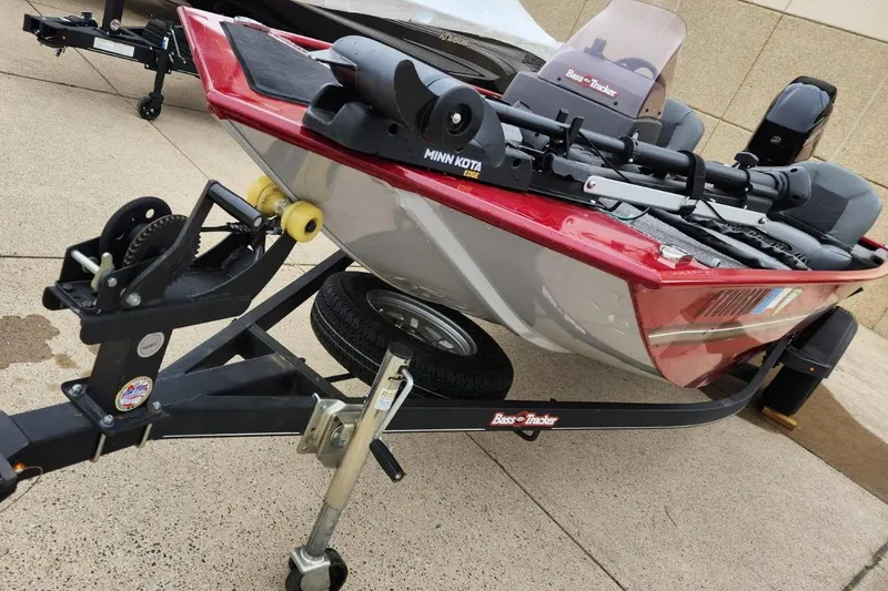 Slide: The Image of 2021 Tracker Bass Tracker Classic XL boat on trailer, featuring Minn Kota trolling motor. - 2