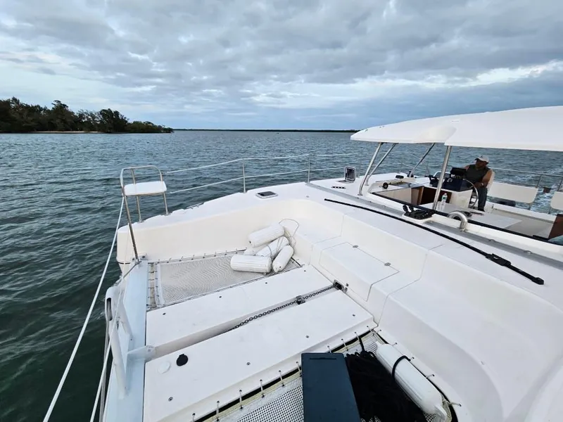 Slide: The Image of Modern Smart Cat E280 Electric boat on calm waters under cloudy sky, 2025 model. - 11