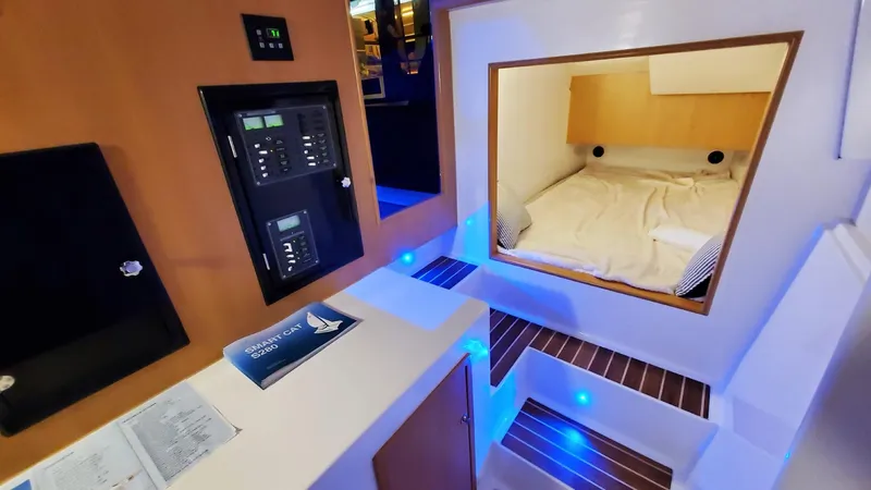 Slide: The Image of Interior of 2025 Smart Cat E280 Electric, featuring cozy cabin and modern control panel. - 37