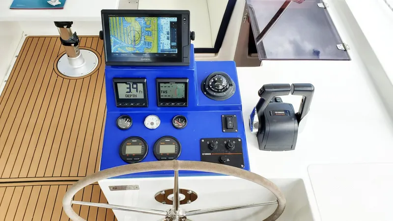 Slide: The Image of Smart Cat E280 Electric 2025 boat dashboard with navigation screen and controls. - 39