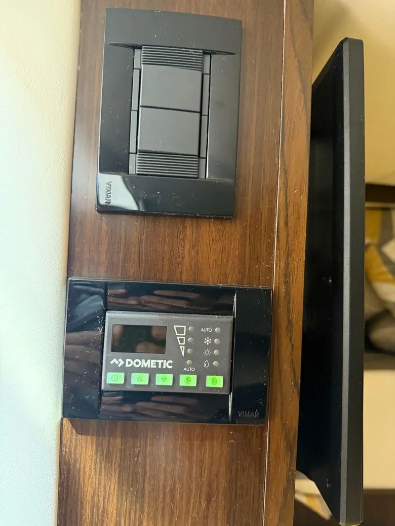 Slide: The Image of Control panel on 2021 Cruisers Yachts 38 GLS OB with Dometic system. - 20