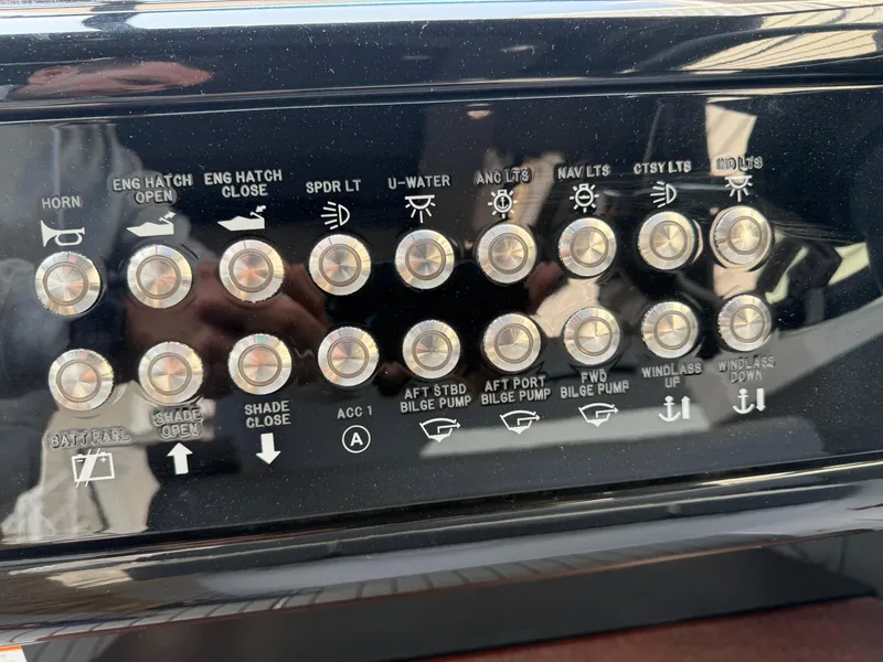Slide: The Image of Control panel of 2021 Cruisers Yachts 38 GLS OB with labeled switches and buttons. - 25