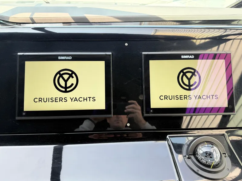 Slide: The Image of Dashboard of 2021 Cruisers Yachts 38 GLS OB with dual Simrad displays. - 26
