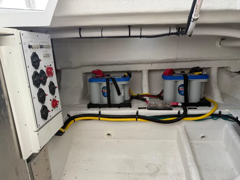 Slide: The Image of Electrical panel and batteries in 2021 Cruisers Yachts 38 GLS OB boat. - 27