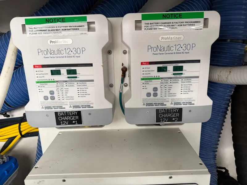 Slide: The Image of Battery chargers on 2021 Cruisers Yachts 38 GLS OB, ProNautic 12-30P models. - 29