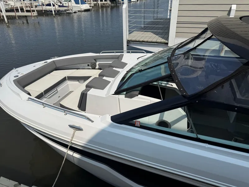 Slide: The Image of 2021 Cruisers Yachts 38 GLS OB docked, showcasing sleek design and spacious seating. - 3