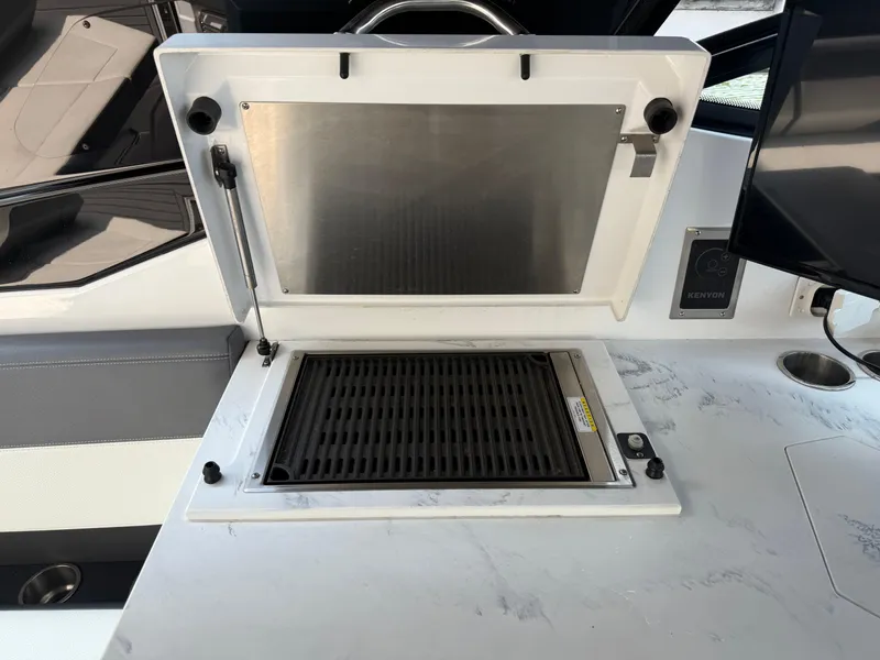 Slide: The Image of Outdoor grill on 2021 Cruisers Yachts 38 GLS OB boat, featuring sleek design and functionality. - 31