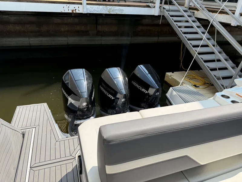 Slide: The Image of 2021 Cruisers Yachts 38 GLS OB with triple Mercury outboard engines docked. - 32