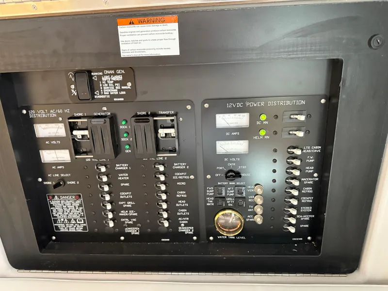 Slide: The Image of Electrical panel of 2021 Cruisers Yachts 38 GLS OB, showing power distribution controls. - 33