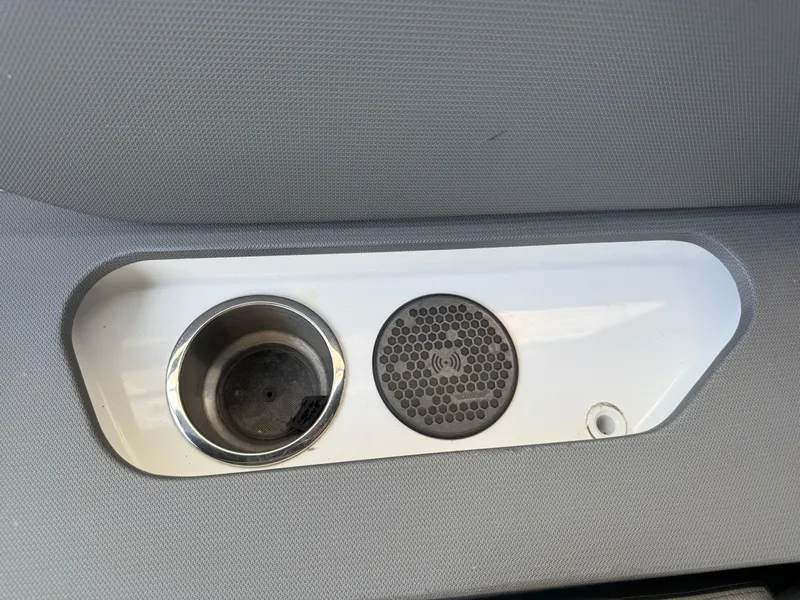 Slide: The Image of Cup holder and speaker on 2021 Cruisers Yachts 38 GLS OB interior panel. - 36