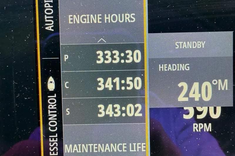 Slide: The Image of Display screen showing engine hours and heading for 2021 Cruisers Yachts 38 GLS OB. - 41