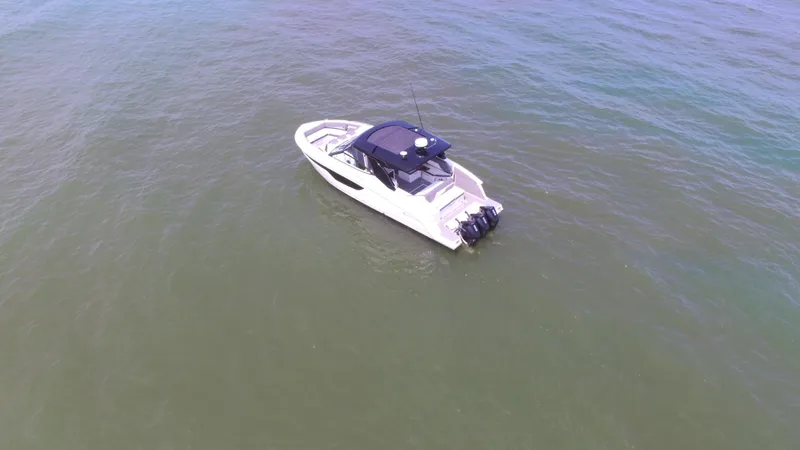 Slide: The Image of 2021 Cruisers Yachts 38 GLS OB on open water, aerial view. - 44