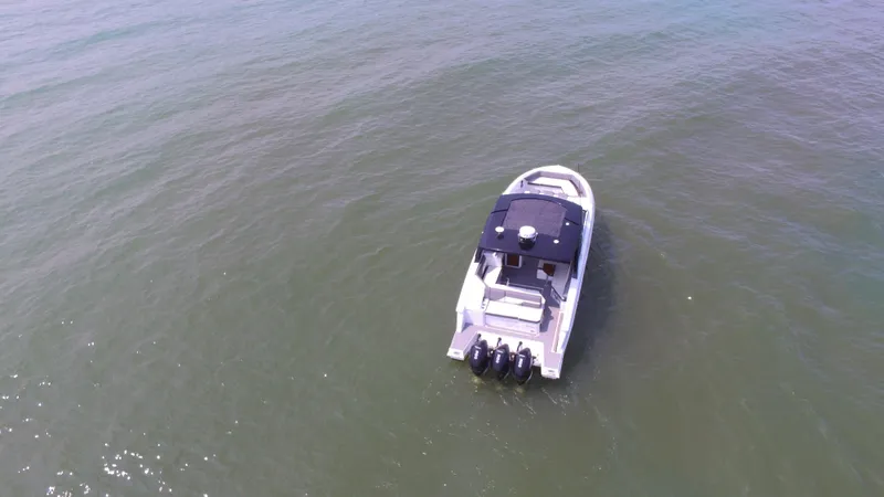 Slide: The Image of Aerial view of 2021 Cruisers Yachts 38 GLS OB on open water. - 45