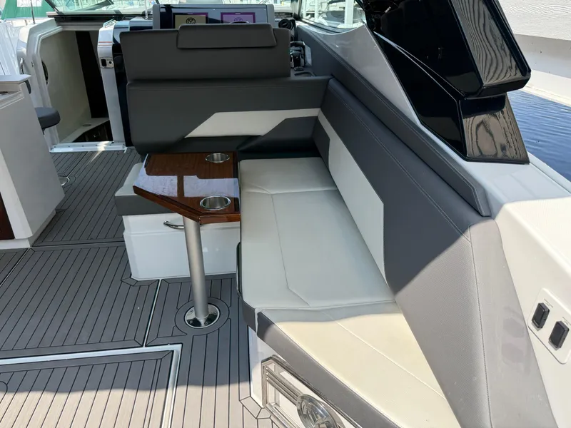 Slide: The Image of 2021 Cruisers Yachts 38 GLS OB interior with sleek seating and modern design. - 6