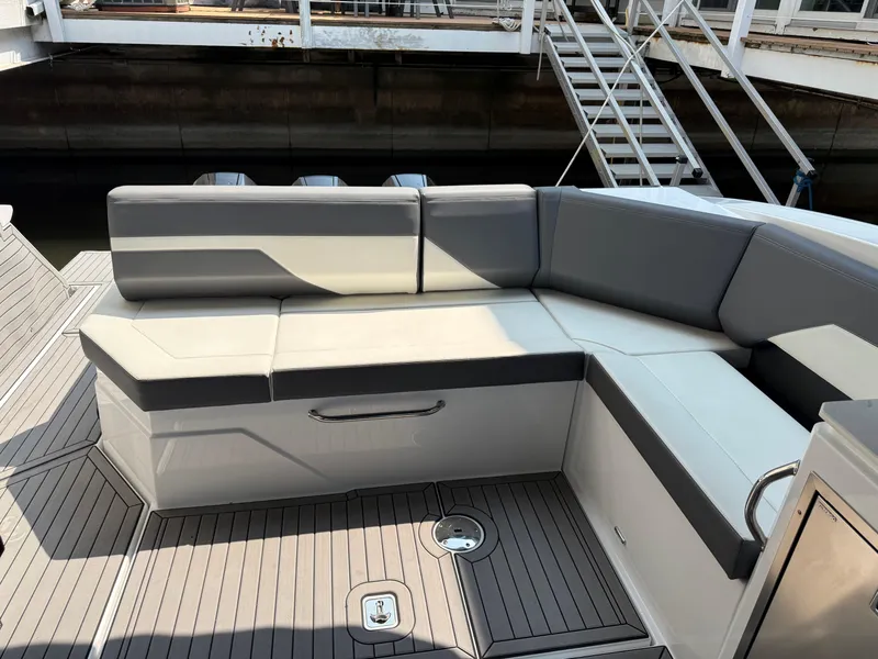 Slide: The Image of 2021 Cruisers Yachts 38 GLS OB interior seating with gray and white upholstery. - 7