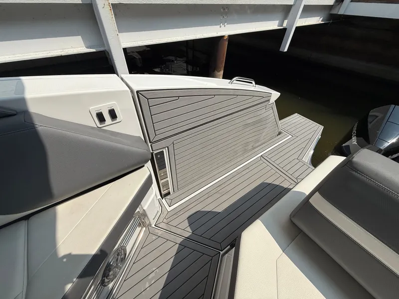 Slide: The Image of 2021 Cruisers Yachts 38 GLS OB deck with sleek, modern design and wood finish. - 8