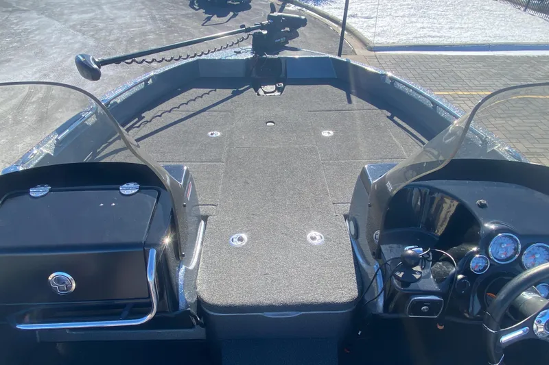 Slide: The Image of 2018 Nitro ZV 18 boat interior with dual consoles and trolling motor. - 5