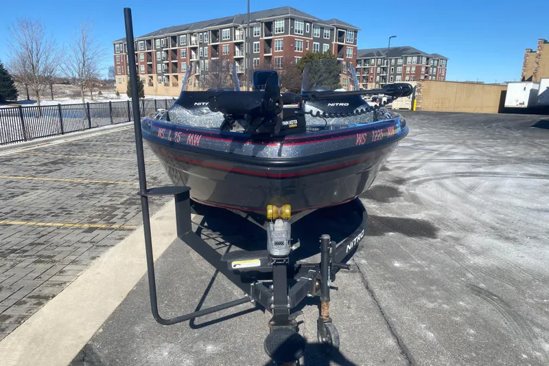 Slide: The Image of 2018 Nitro ZV 18 boat on trailer in urban parking lot. - 7