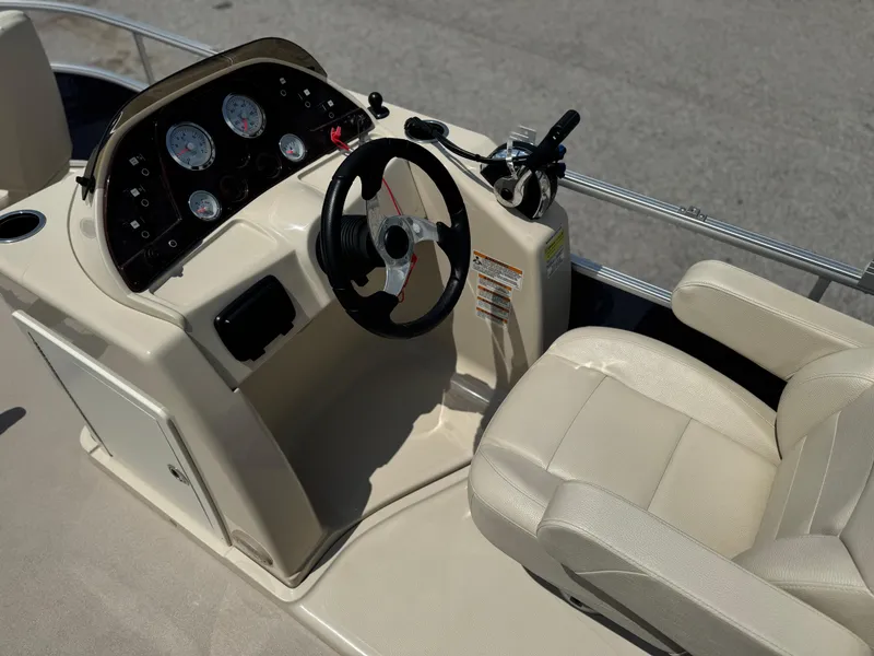 Slide: The Image of 2014 SunChaser Classic Cruise 8520 boat dashboard with steering wheel and gauges. - 10