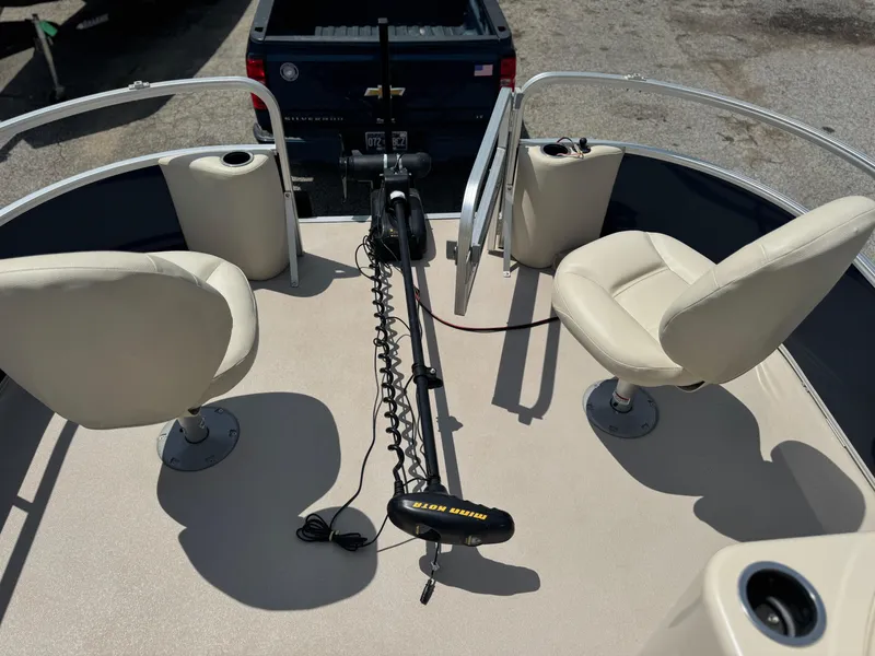 Slide: The Image of 2014 SunChaser Classic Cruise 8520 boat deck with seating and motor, viewed from above. - 11