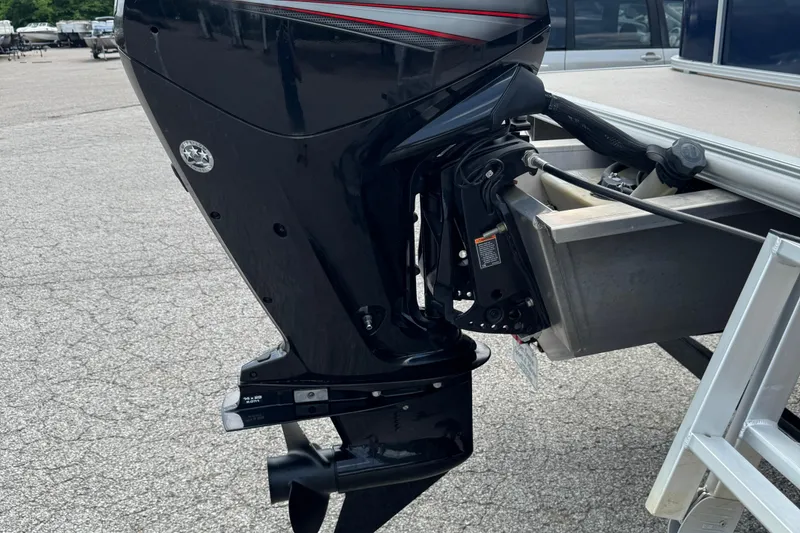 Slide: The Image of Outboard motor of a 2014 SunChaser Classic Cruise 8520 boat on a trailer. - 2