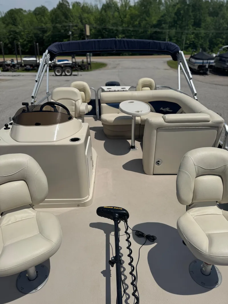 Slide: The Image of 2014 SunChaser Classic Cruise 8520 pontoon boat with beige seating and canopy. - 9
