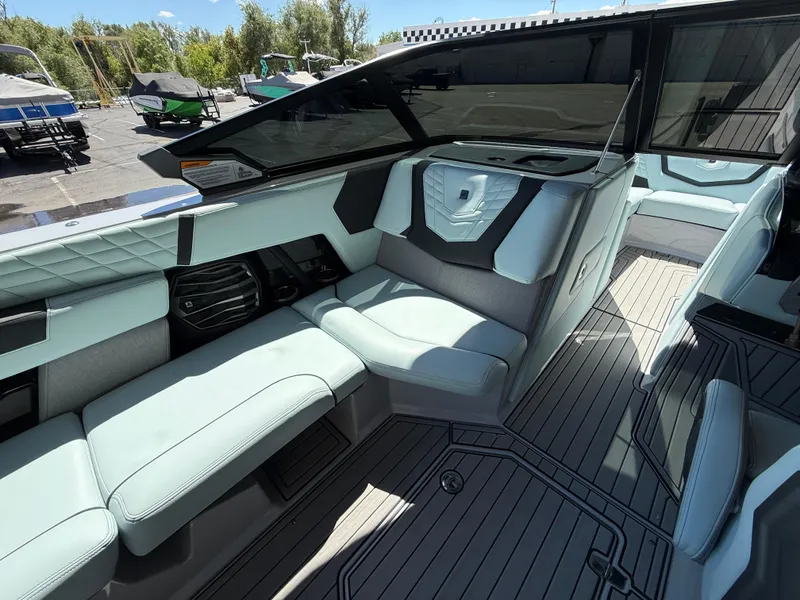 Slide: The Image of 2023 Nautique Super Air G23 interior with sleek seating and modern design. - 11