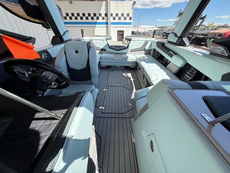 Slide: The Image of 2023 Nautique Super Air G23 interior with luxurious seating and modern design. - 15