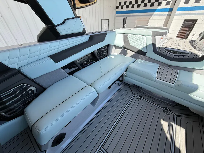 Slide: The Image of 2023 Nautique Super Air G23 interior with luxurious seating and modern design. - 16