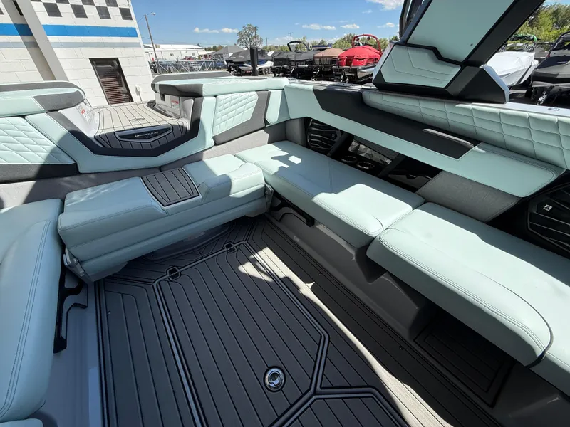 Slide: The Image of 2023 Nautique Super Air G23 interior with luxurious seating and modern design. - 17