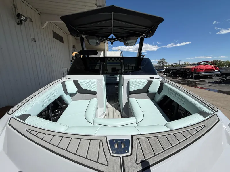 Slide: The Image of 2023 Nautique Super Air G23 boat with luxurious seating and sleek design. - 3