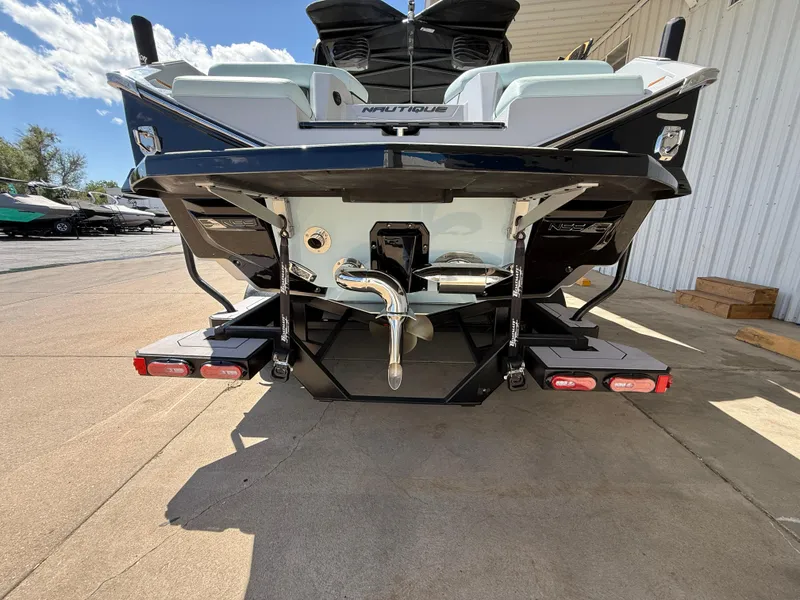 Slide: The Image of 2023 Nautique Super Air G23 boat rear view, showcasing sleek design and advanced features. - 7